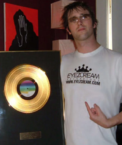 Dave Armstrong pictured with his Gold Record for Make Your Move, ~2004
